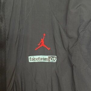 Nike Black Puffer Jacket with Red and Silver Accents